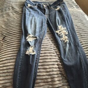 Holes in front legs and back pockets